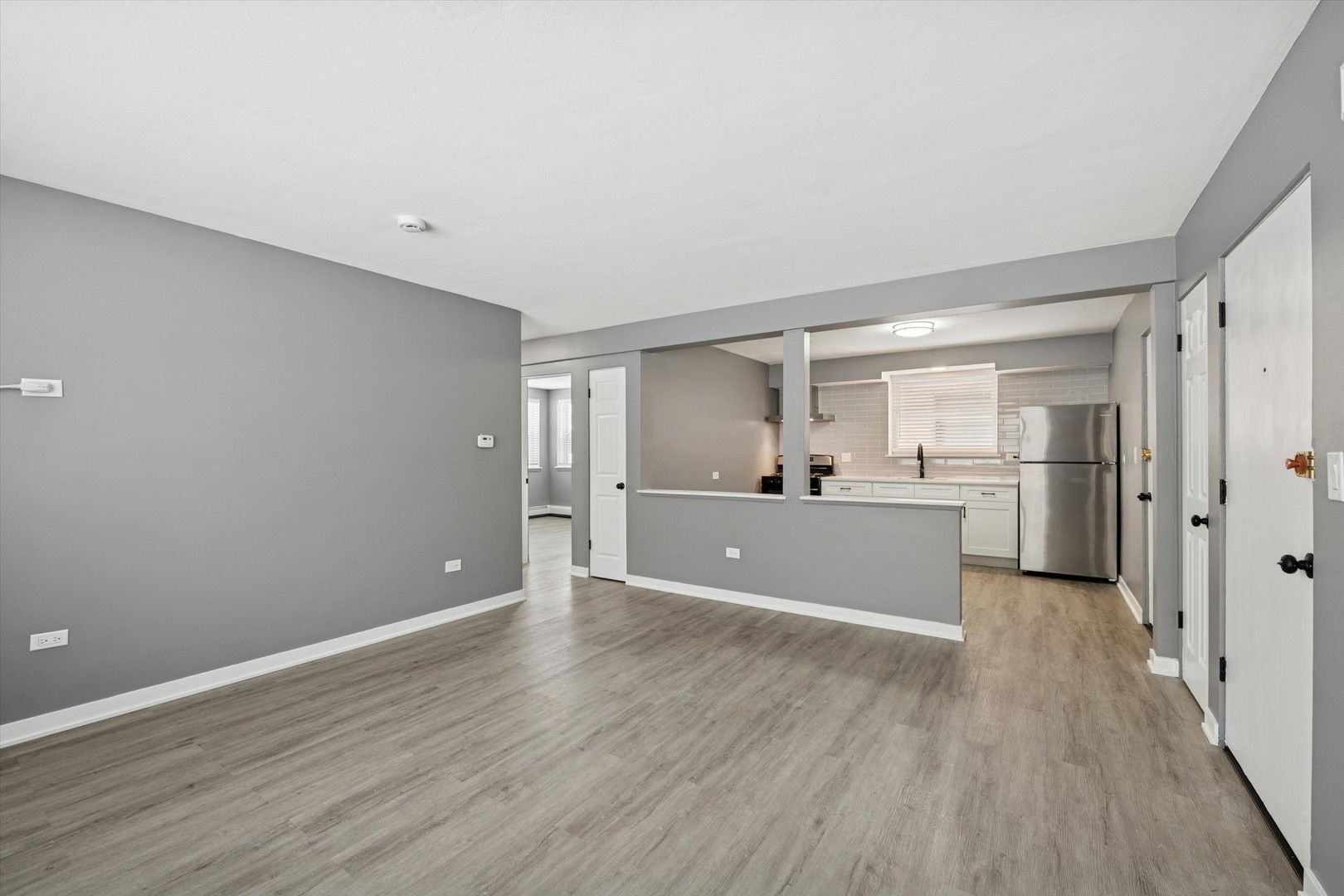 1910 16th Avenue, Unit 3 Broadview, IL 60155 - Photo 7 of 14 a view of a kitchen with wooden floor and a sink