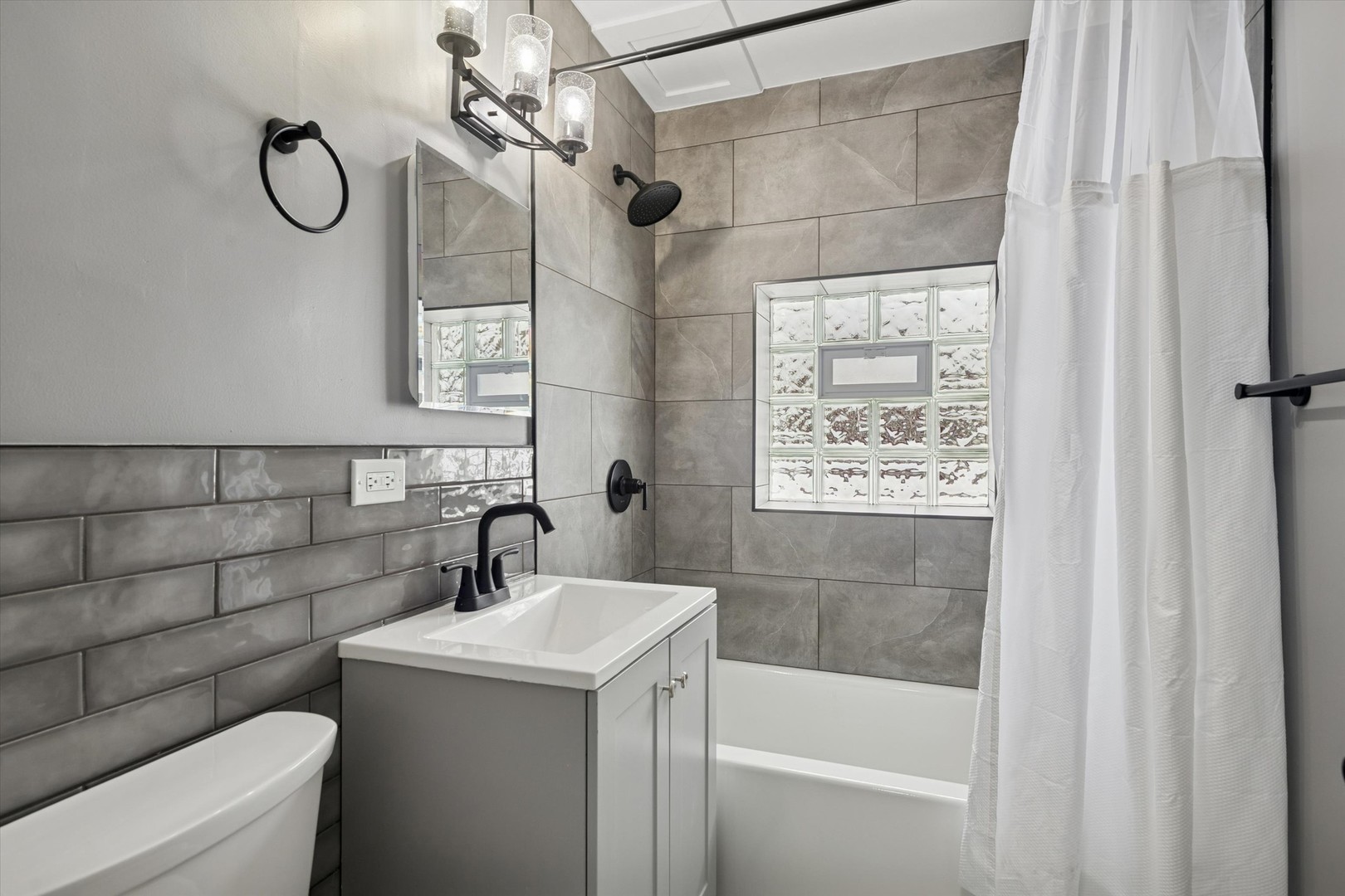 1910 16th Avenue, Unit 3 Broadview, IL 60155 - Photo 10 of 14 a bathroom with a sink a toilet and shower