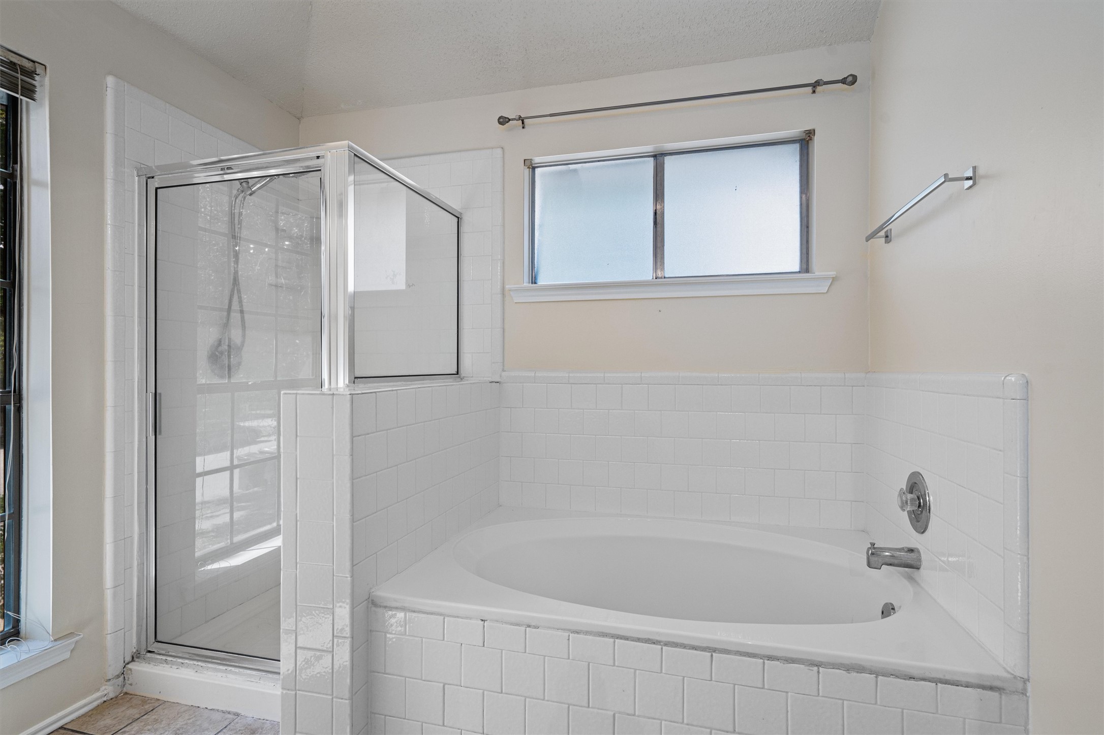4700 Fallenash Drive Austin, TX 78725 - Photo 21 of 33 a bathroom with a bathtub and a shower