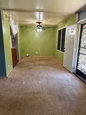 a view of empty room with windows