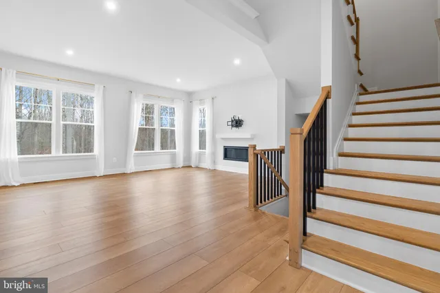 a view of an entryway with wooden floor and stairs