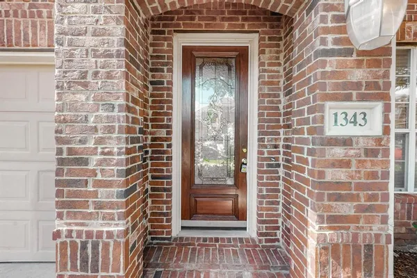 a view of a door and a window