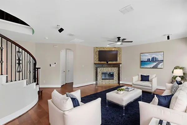 a living room with furniture and a flat screen tv