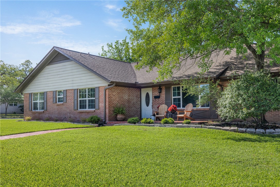 800 Esther Boulevard Bryan, TX 77802 - Photo 2 of 37 a front view of a house with a yard and trees