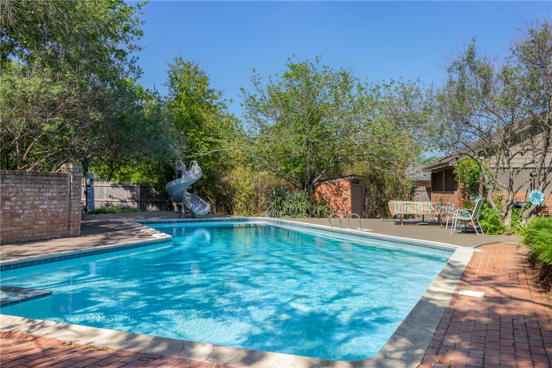800 Esther Boulevard Bryan, TX 77802 - Photo 5 of 37 a view of a swimming pool with a patio