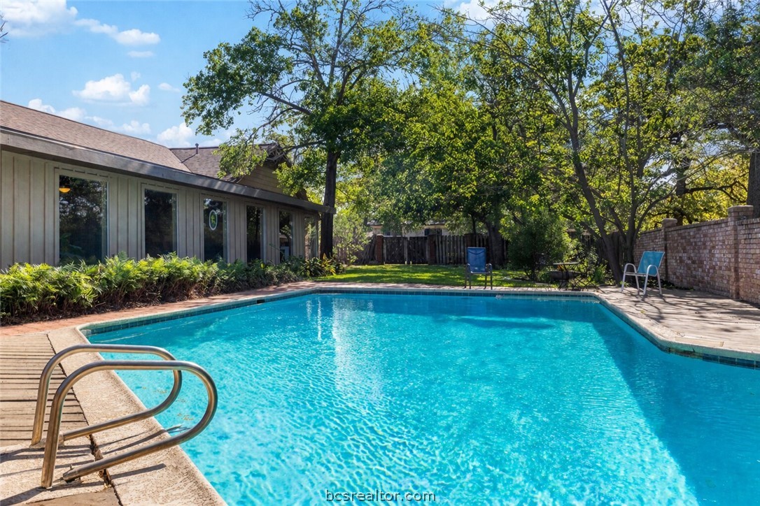 800 Esther Boulevard Bryan, TX 77802 - Photo 6 of 37 a view of swimming pool with lounge chair