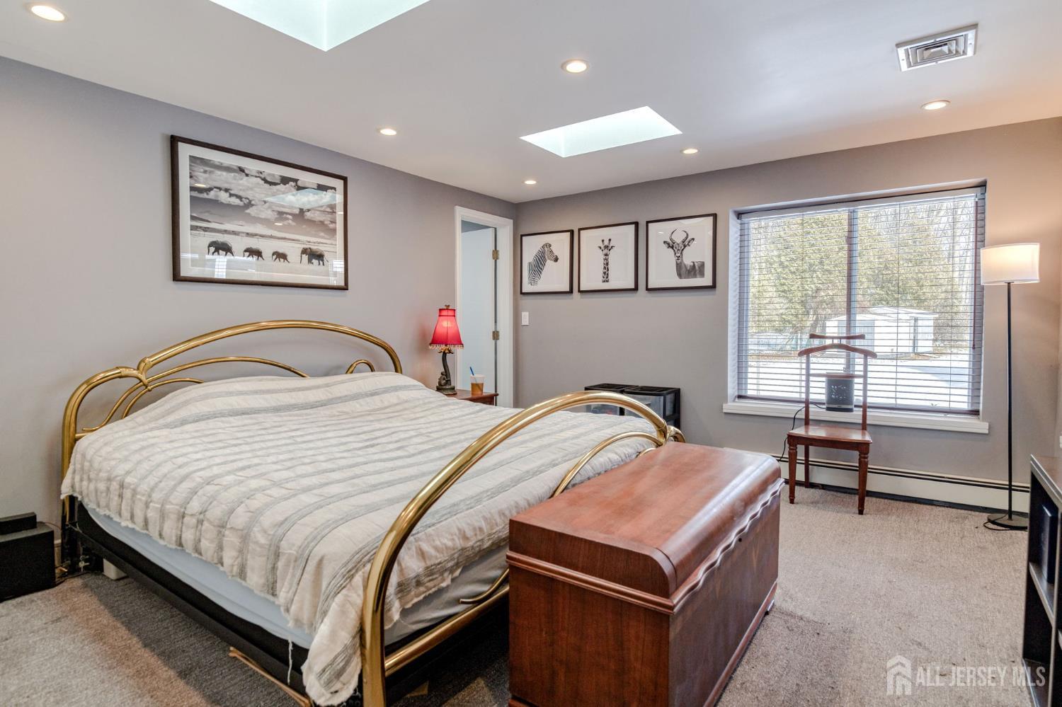 25 Davidson's Mill Road North Brunswick, NJ 08902 - Photo 23 of 56 a bedroom with a bed and glass windows