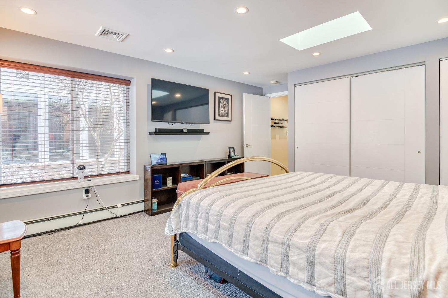 25 Davidson's Mill Road North Brunswick, NJ 08902 - Photo 25 of 56 a bedroom with a large bed and a large window