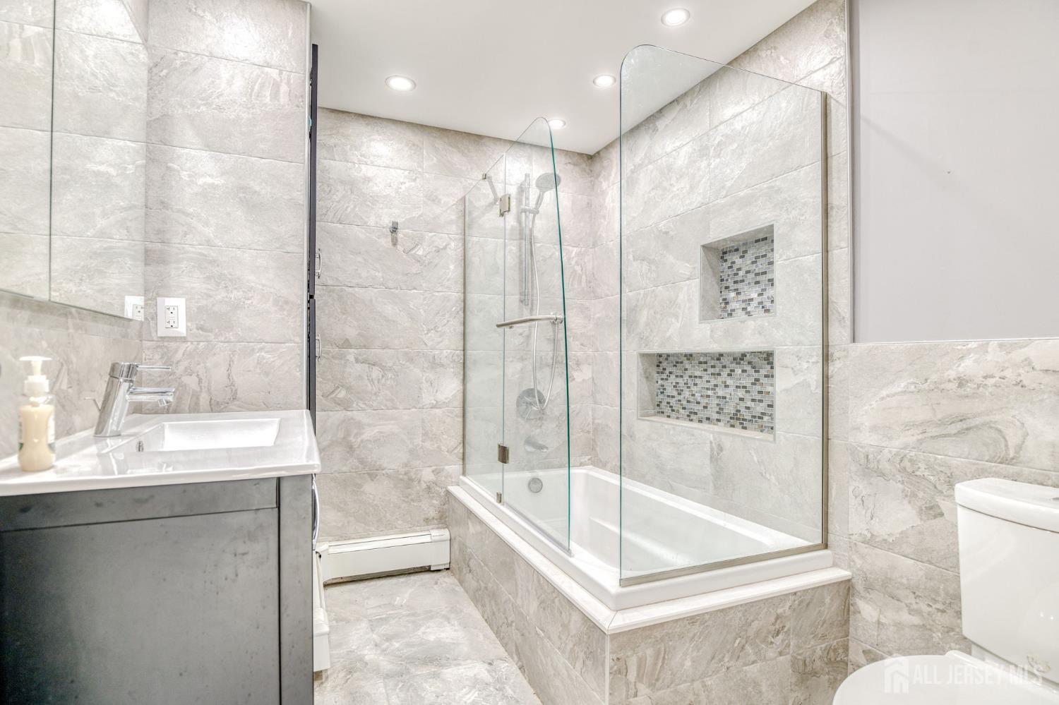 25 Davidson's Mill Road North Brunswick, NJ 08902 - Photo 28 of 56 a bathroom with a bathtub shower sink and toilet