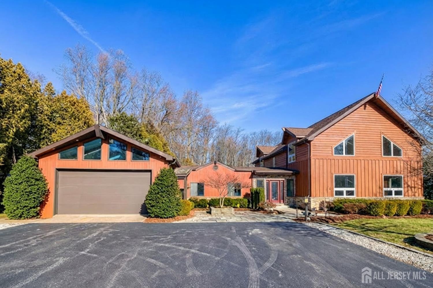 25 Davidson's Mill Road North Brunswick, NJ 08902 - Photo 50 of 56 a front view of a house with a yard and garage