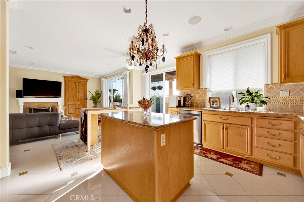 11233 Ravenna Lane Porter Ranch, CA 91326 - Photo 15 of 46 a living room with granite countertop furniture and a flat screen tv