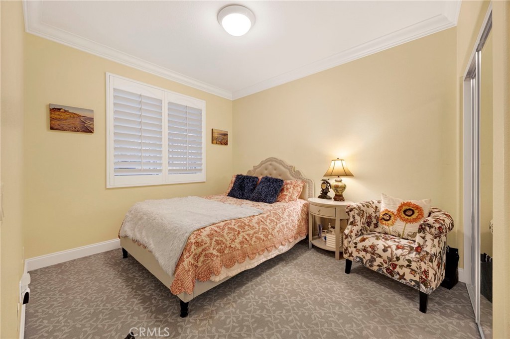 11233 Ravenna Lane Porter Ranch, CA 91326 - Photo 16 of 46 a bedroom with two beds and a window