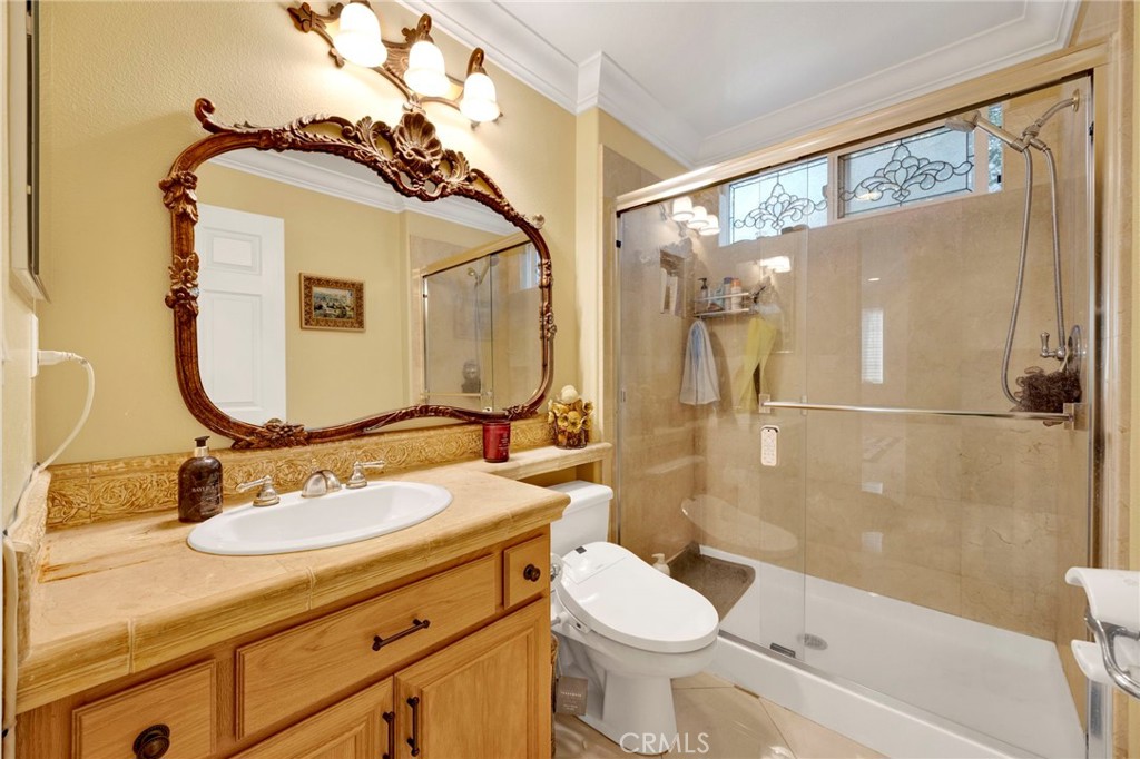 11233 Ravenna Lane Porter Ranch, CA 91326 - Photo 17 of 46 a bathroom with a sink toilet and shower
