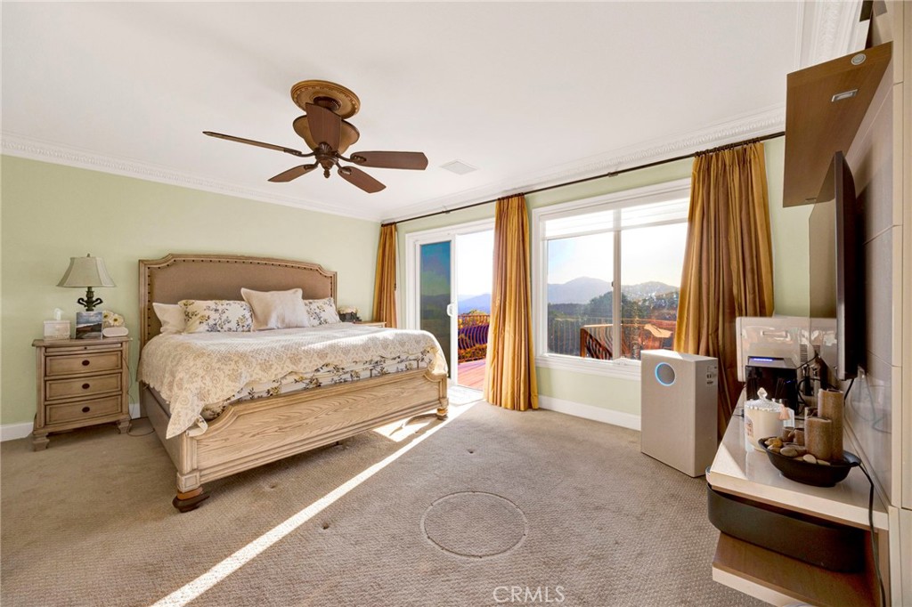 11233 Ravenna Lane Porter Ranch, CA 91326 - Photo 20 of 46 a bedroom with a large bed and a large window