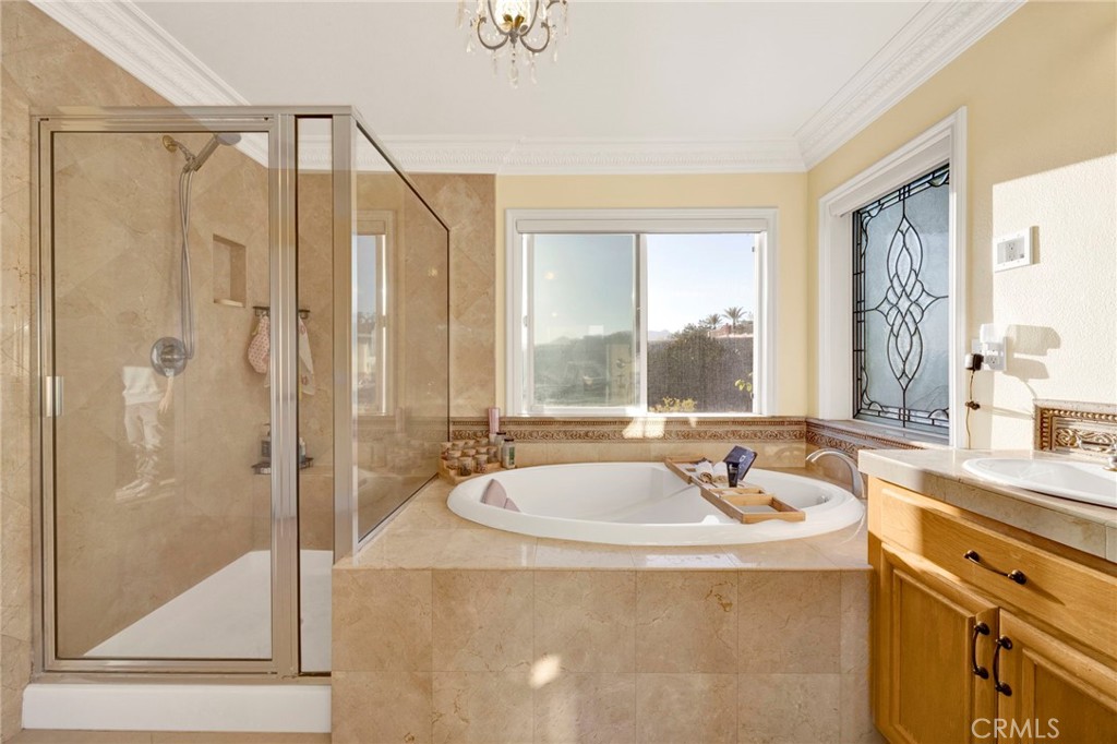 11233 Ravenna Lane Porter Ranch, CA 91326 - Photo 22 of 46 a bathroom with a tub sink and mirror
