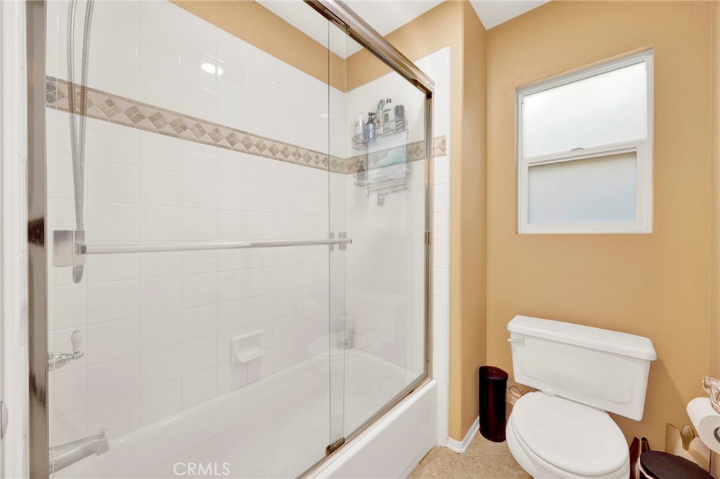 11233 Ravenna Lane Porter Ranch, CA 91326 - Photo 28 of 46 a white toilet sitting next to a bath tub shower