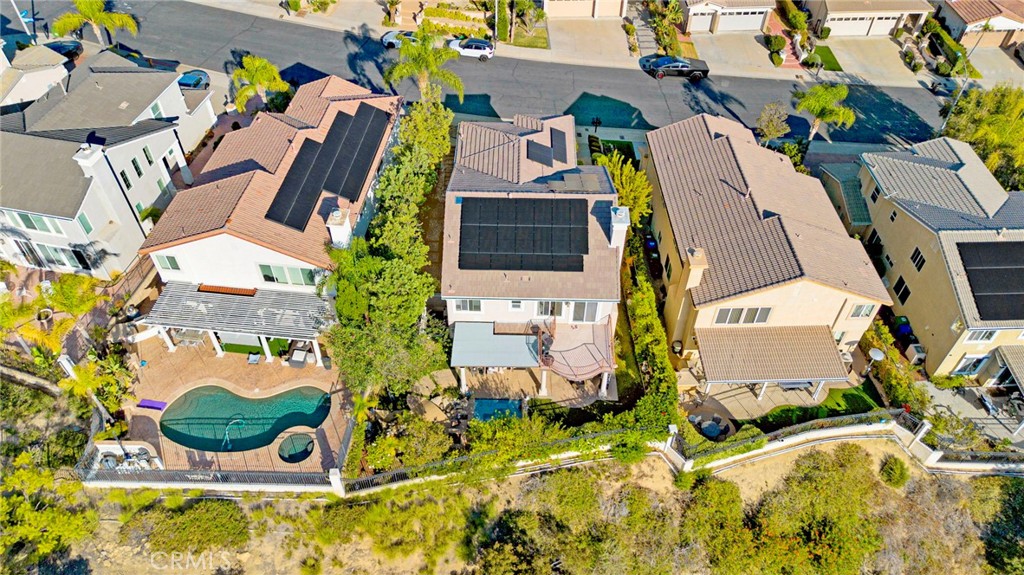 11233 Ravenna Lane Porter Ranch, CA 91326 - Photo 38 of 46 an aerial view of a residential apartment building with a yard and parking space