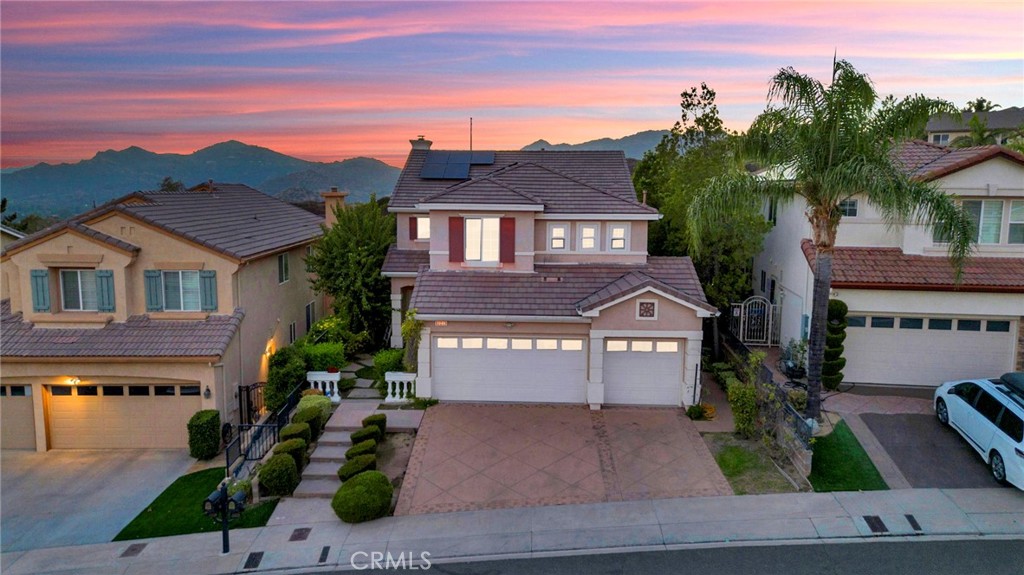 11233 Ravenna Lane Porter Ranch, CA 91326 - Photo 42 of 46 a front view of a house with garden