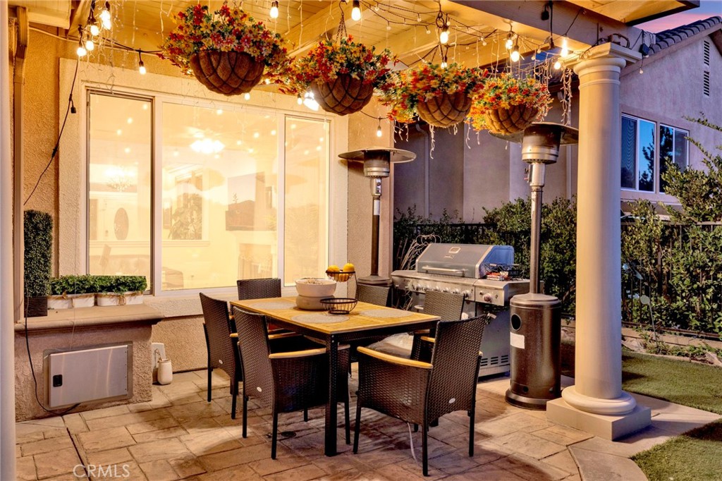 11233 Ravenna Lane Porter Ranch, CA 91326 - Photo 45 of 46 a outdoor dining space with furniture and a potted plant