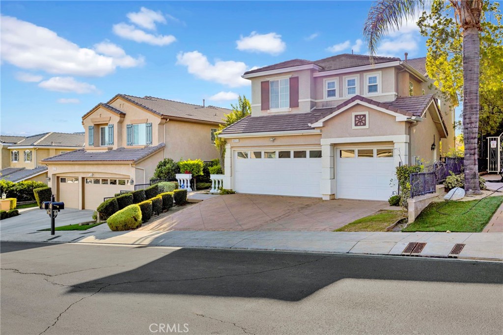 11233 Ravenna Lane Porter Ranch, CA 91326 - Photo 46 of 46 a front view of a house with a yard