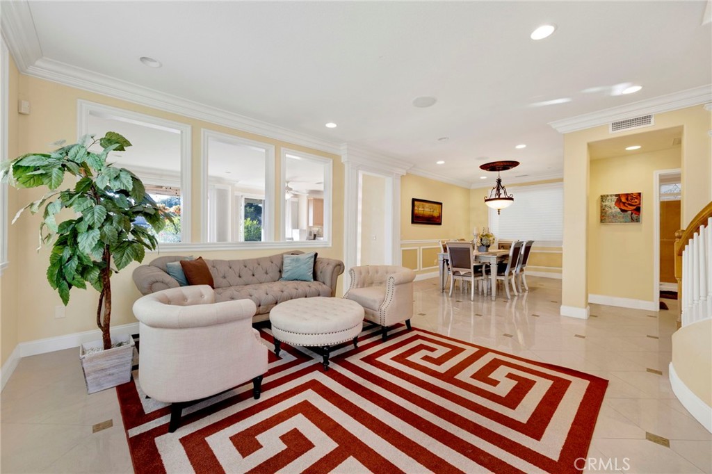 11233 Ravenna Lane Porter Ranch, CA 91326 - Photo 8 of 46 a living room with furniture and a large window