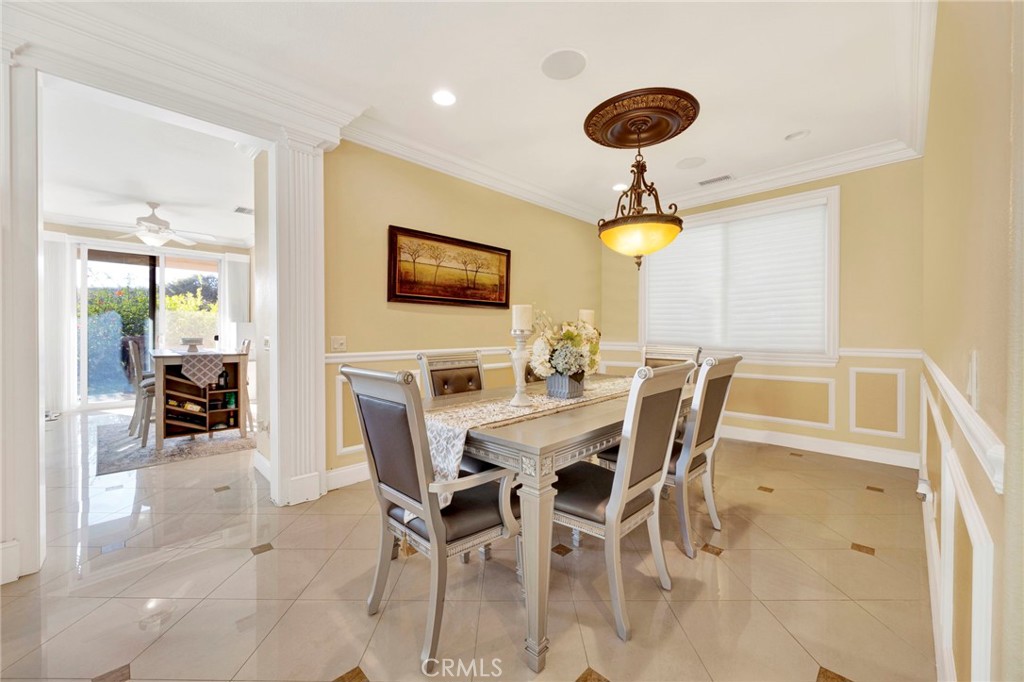 11233 Ravenna Lane Porter Ranch, CA 91326 - Photo 9 of 46 a view of a dining room with furniture and chandelier