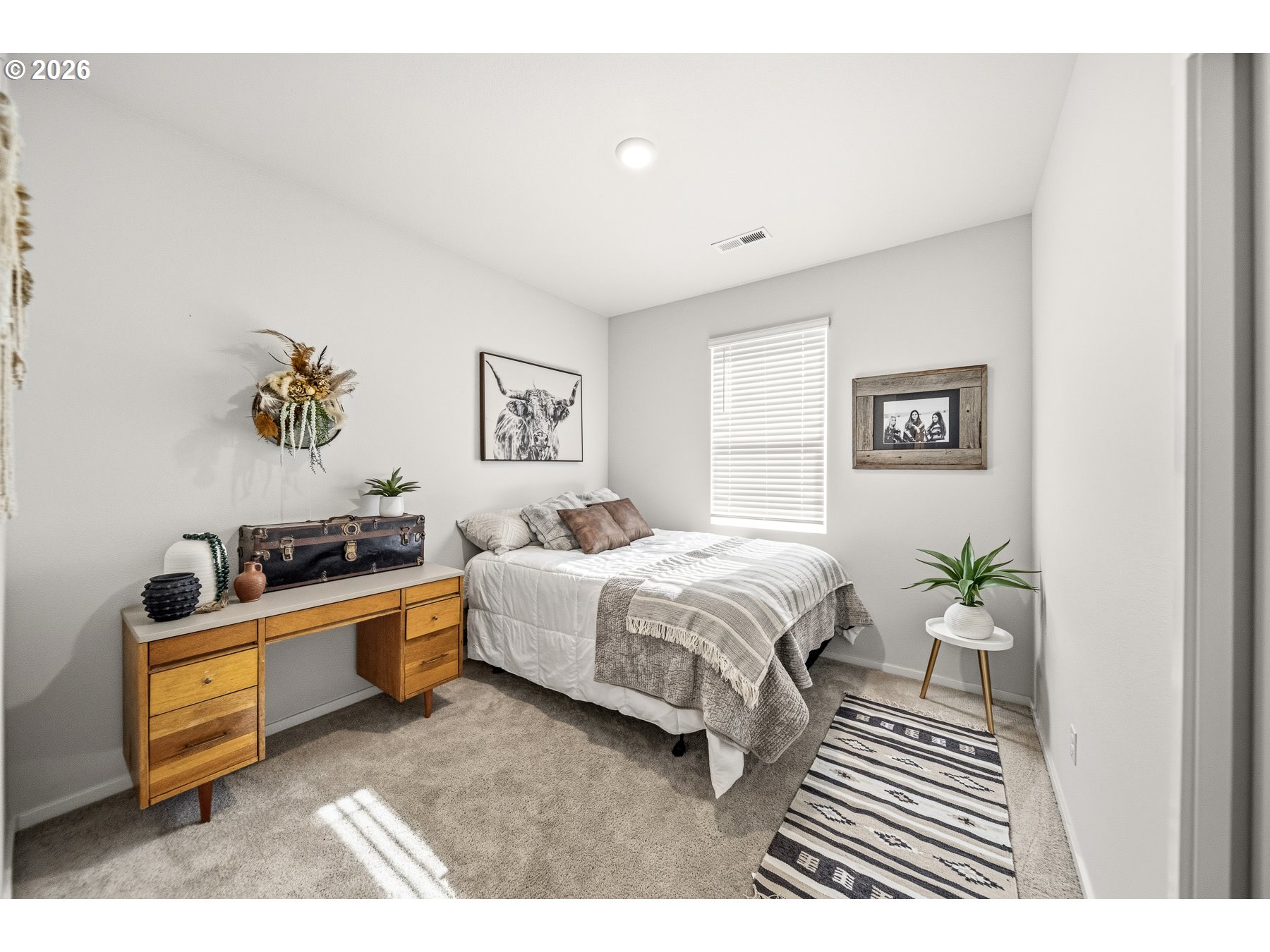 597 Northeast Union Loop Prineville, OR 97754 - Photo 17 of 22 a spacious bedroom with a bed and a couch