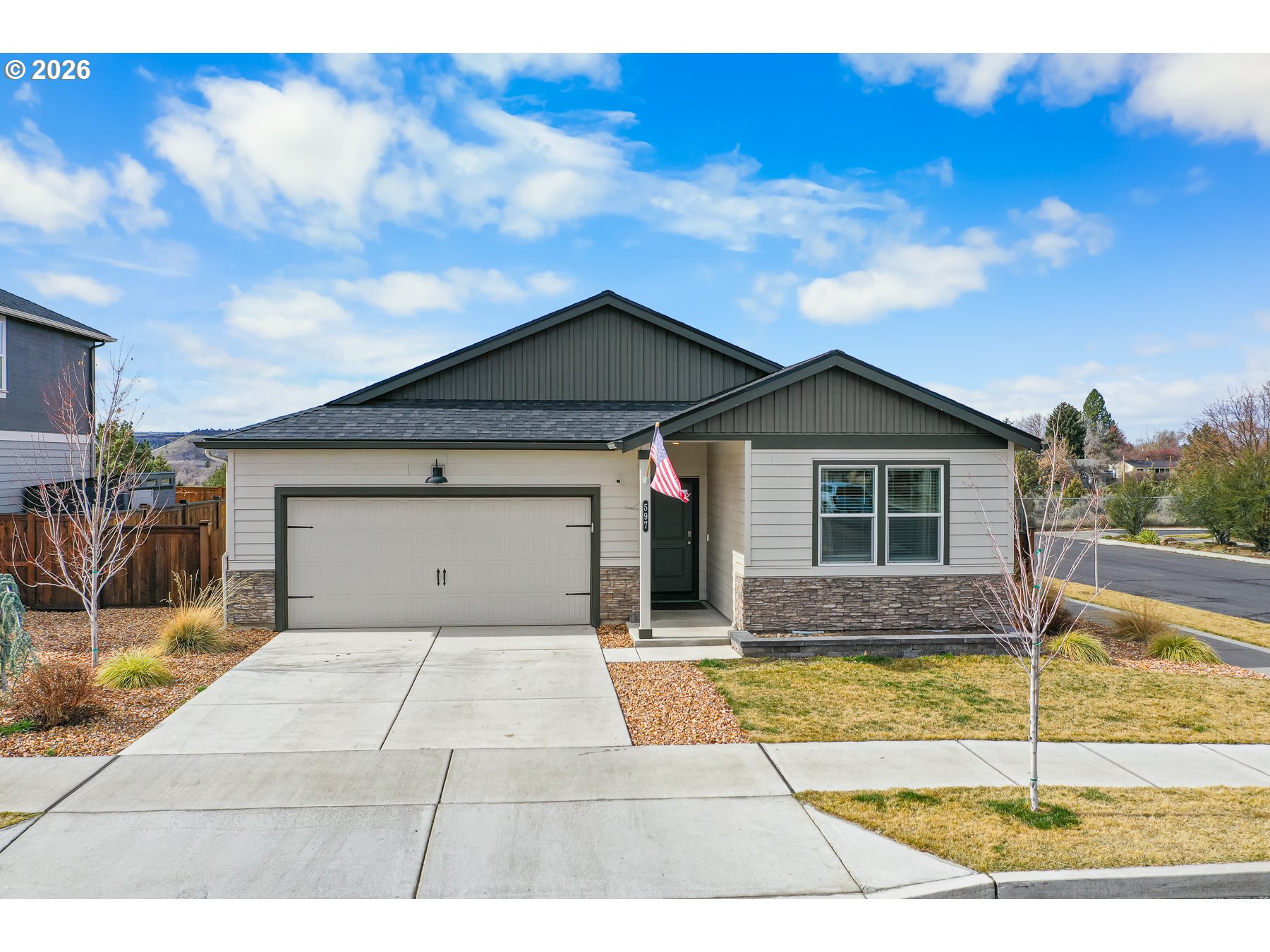 597 Northeast Union Loop Prineville, OR 97754 - Photo 2 of 22 a front view of a house with a yard