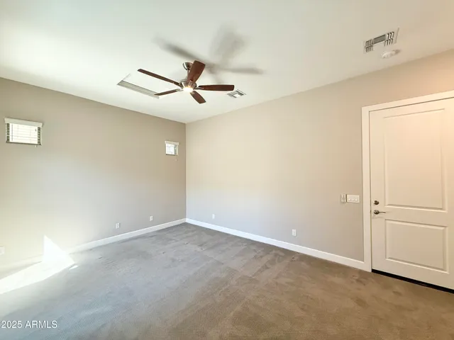 a view of a big room with carpet
