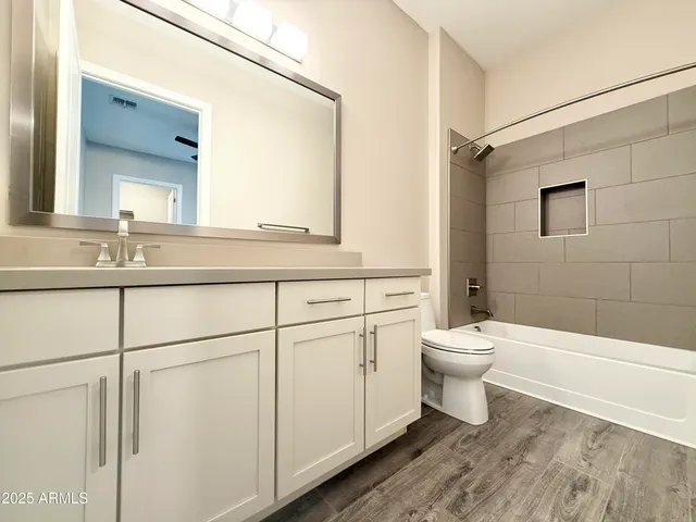 a bathroom with a toilet a sink and a bathtub