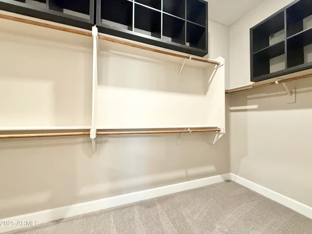 a view of an empty walk in closet