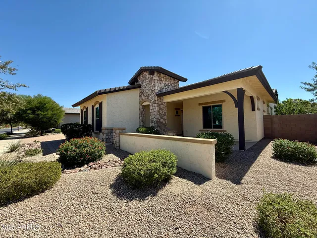 a front view of a house with garage