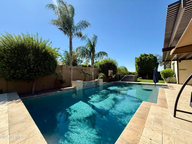 a view of a backyard with a garden and plants