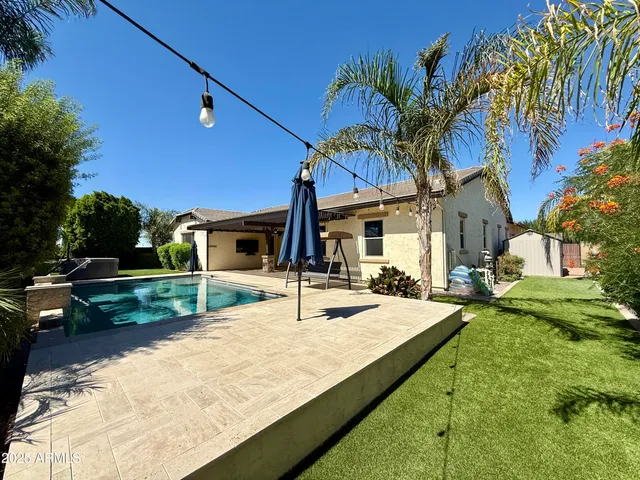 a view of a house with swimming pool