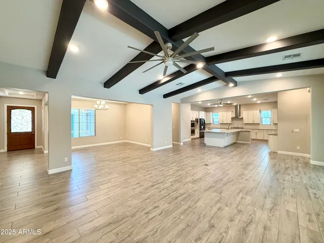 a view of a livingroom with a kitchen