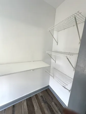 a view of staircase and utility room with stairs