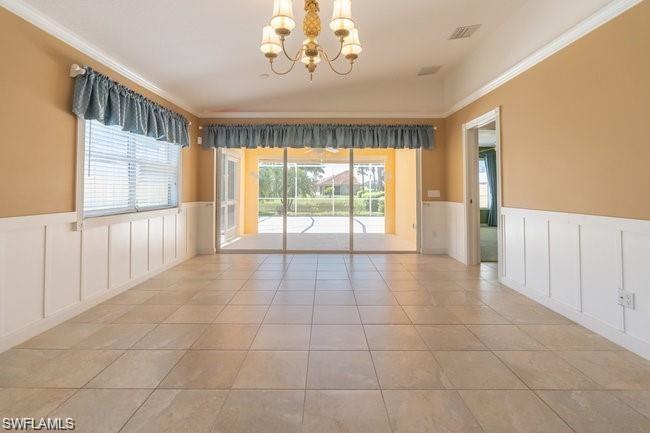 7640 Rozzini Lane Naples, FL 34114 - Photo 4 of 12 a view of an empty room with a window