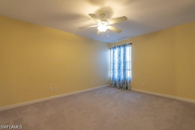 7640 Rozzini Lane Naples, FL 34114 - Photo 10 of 12 an empty room with windows and fan