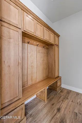 a view of an empty room with floor to ceiling windows