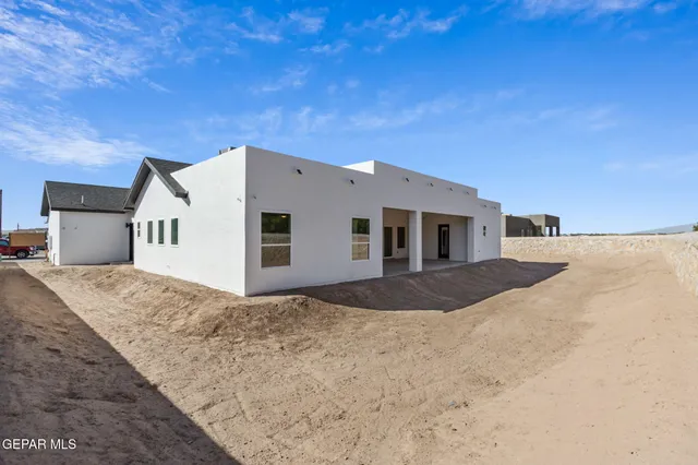 a view of a house with a snow in the background