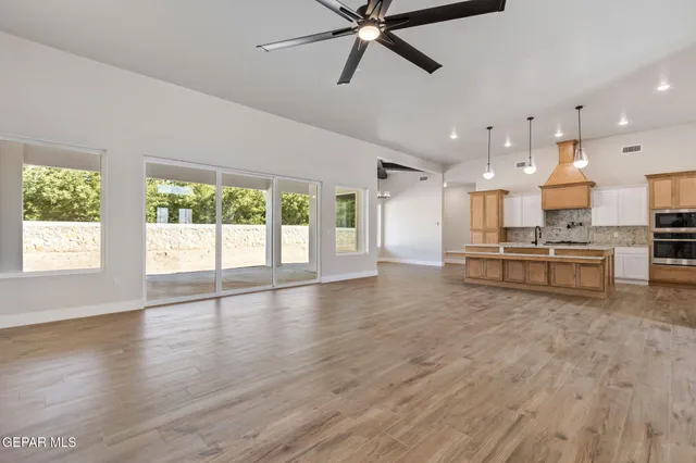 a view of kitchen with wooden floor and window
