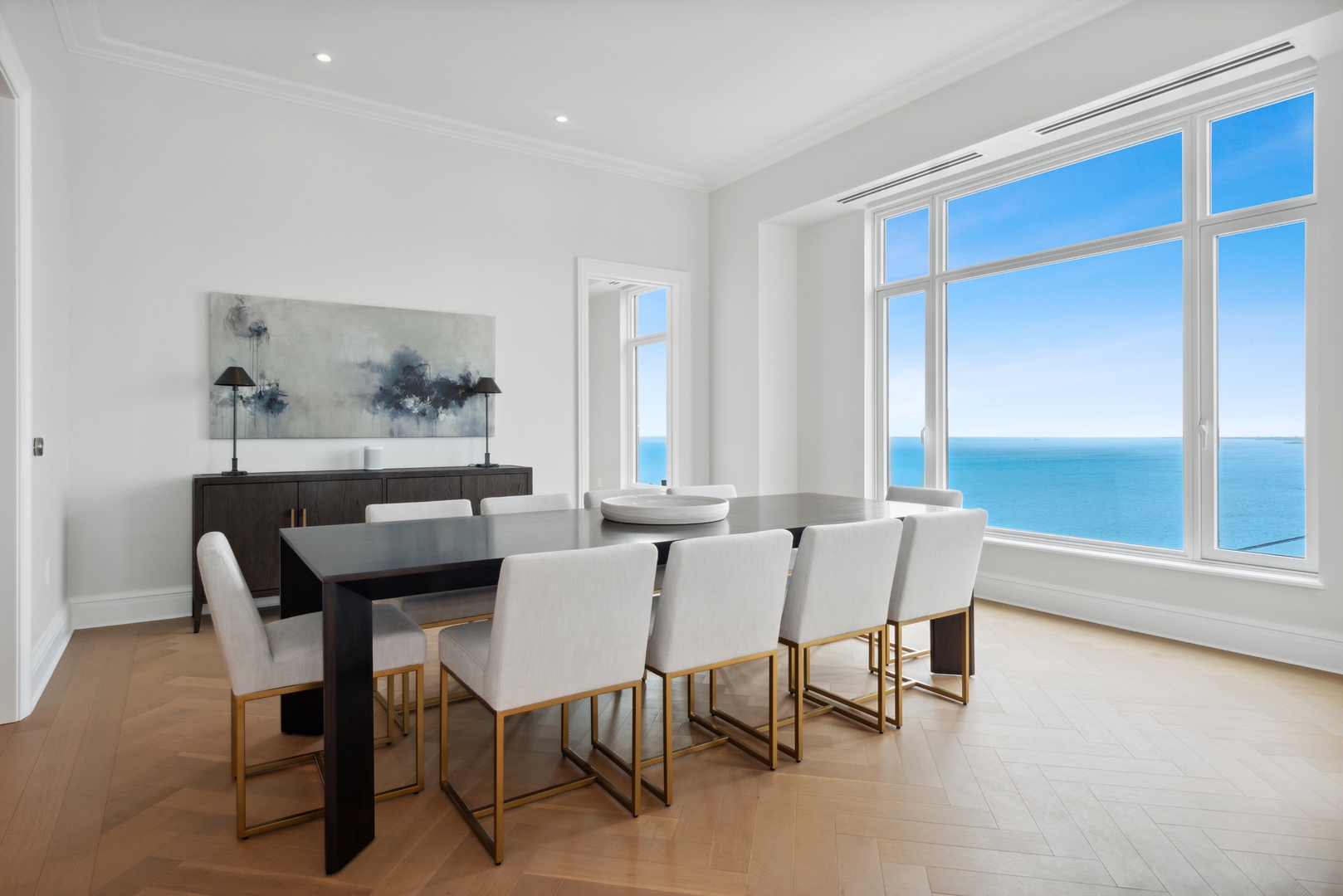451 East Grand Avenue, Unit 5909 Chicago, IL 60611 - Photo 15 of 38 a view of a dining room with furniture and a large window