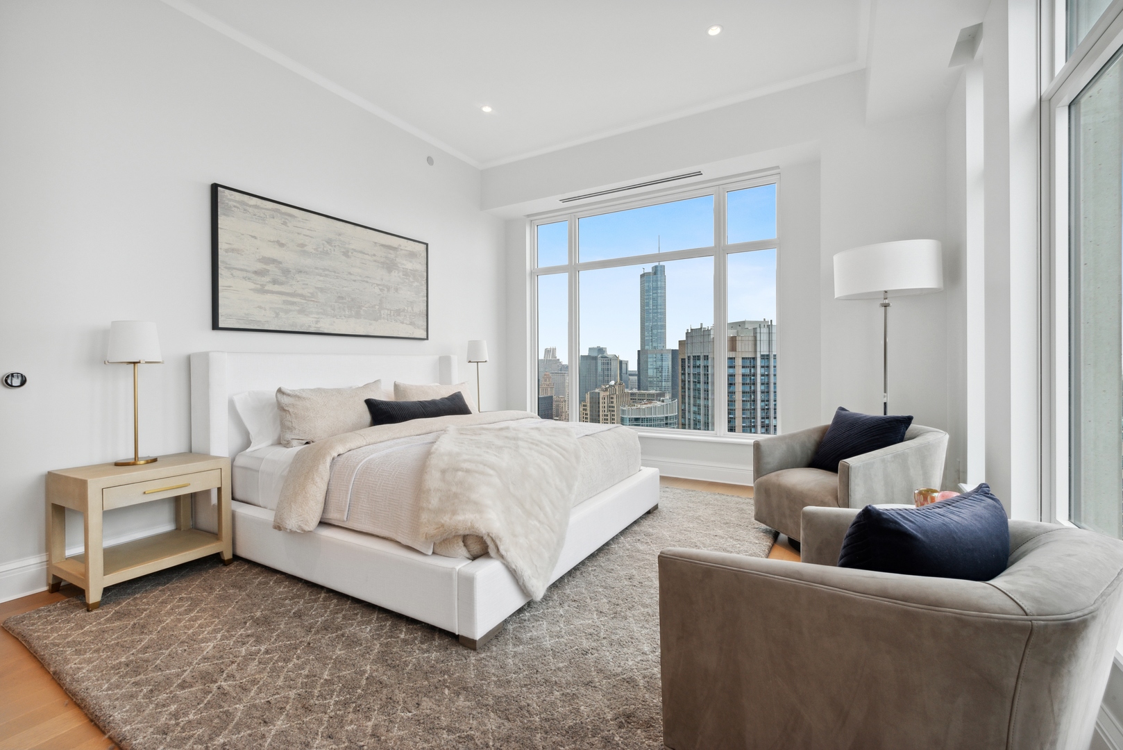 451 East Grand Avenue, Unit 5909 Chicago, IL 60611 - Photo 17 of 38 a bedroom with a bed and glass window