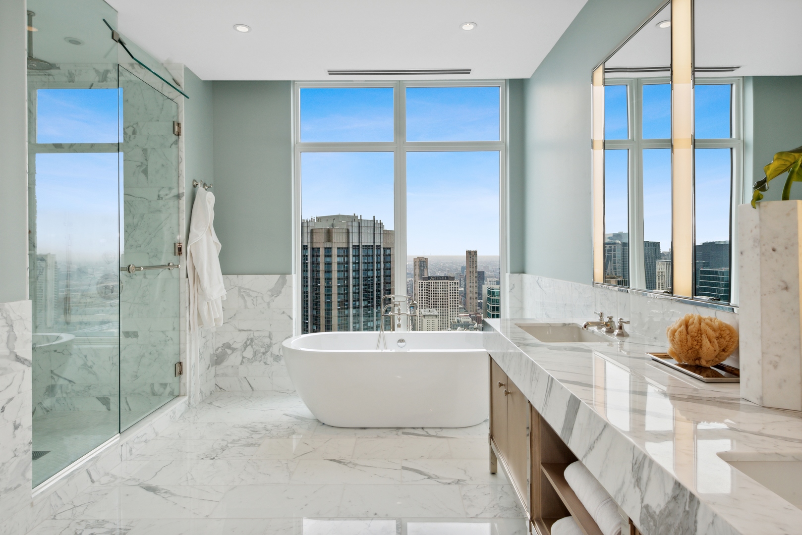 451 East Grand Avenue, Unit 5909 Chicago, IL 60611 - Photo 18 of 38 a bathroom with a tub sink and mirror