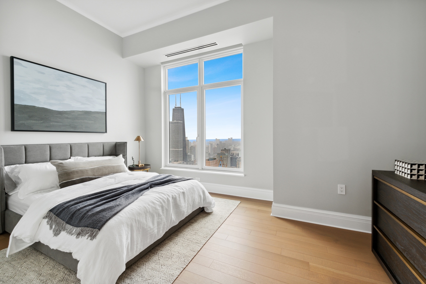 451 East Grand Avenue, Unit 5909 Chicago, IL 60611 - Photo 19 of 38 a bedroom with a bed and a window