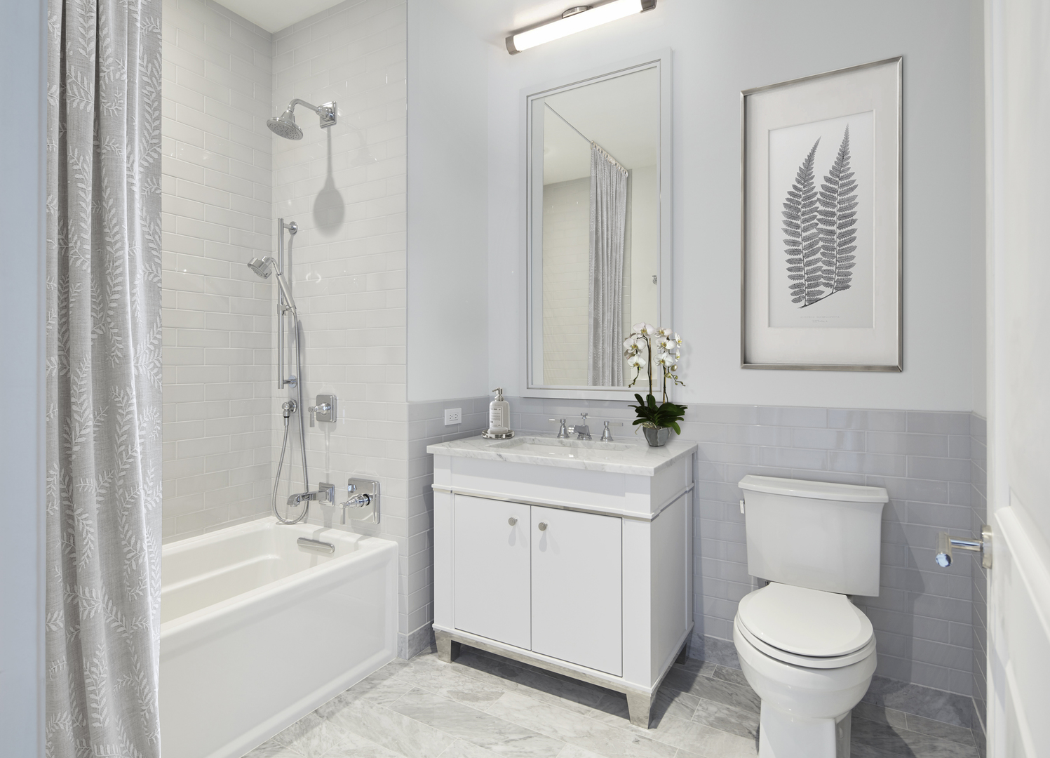 451 East Grand Avenue, Unit 5909 Chicago, IL 60611 - Photo 20 of 38 a bathroom with a granite countertop toilet a sink and a bathtub