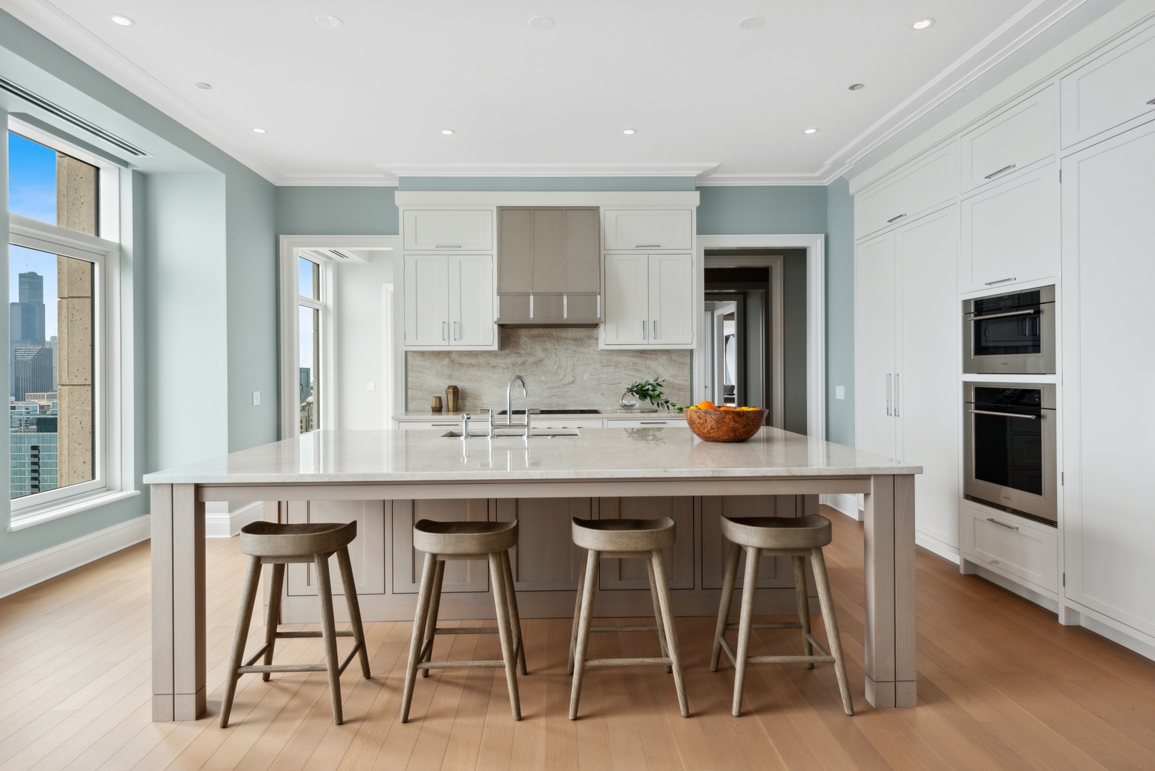451 East Grand Avenue, Unit 5909 Chicago, IL 60611 - Photo 8 of 38 a kitchen with stainless steel appliances granite countertop table chairs sink and cabinets