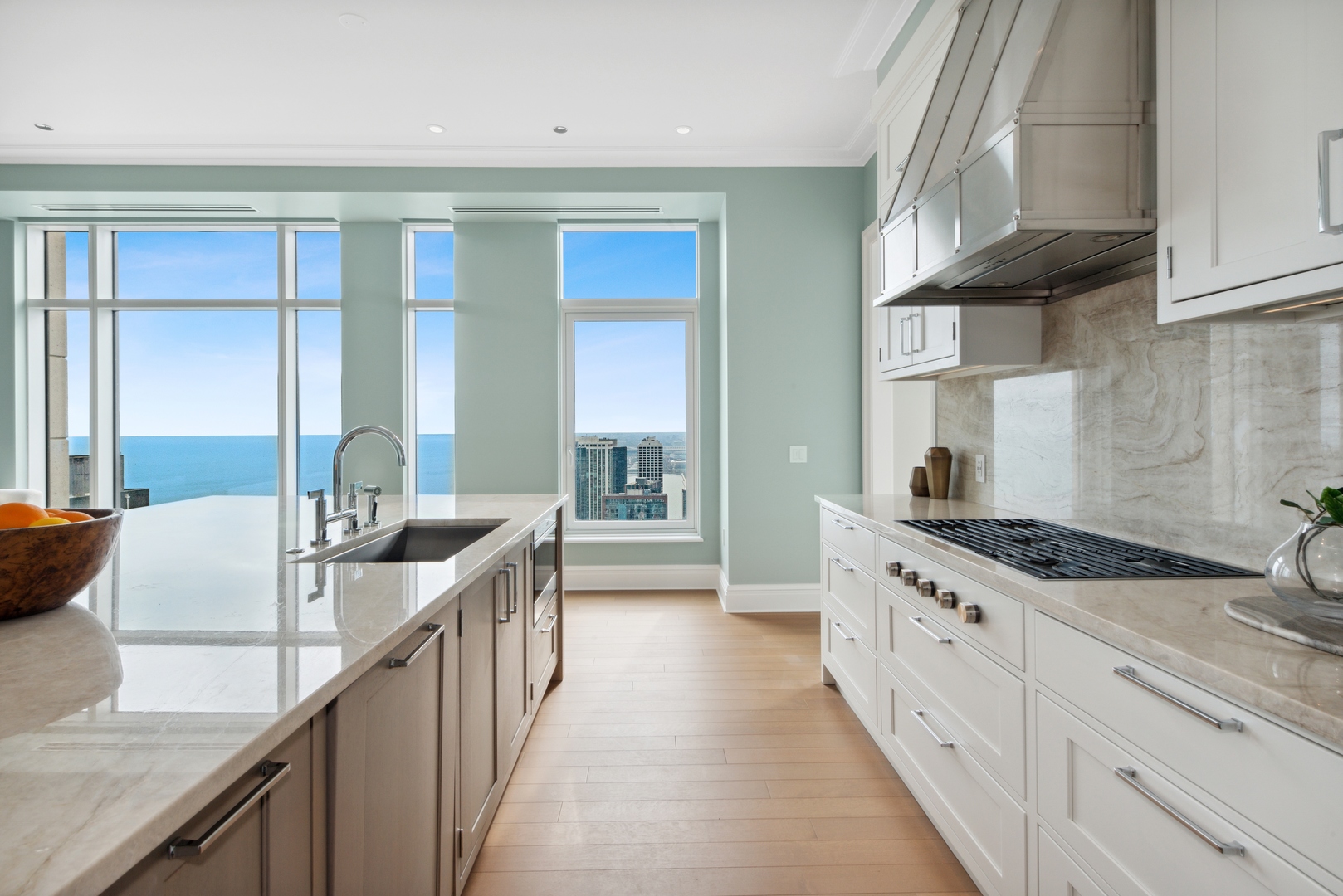 451 East Grand Avenue, Unit 5909 Chicago, IL 60611 - Photo 9 of 38 a kitchen with sink stove and cabinets