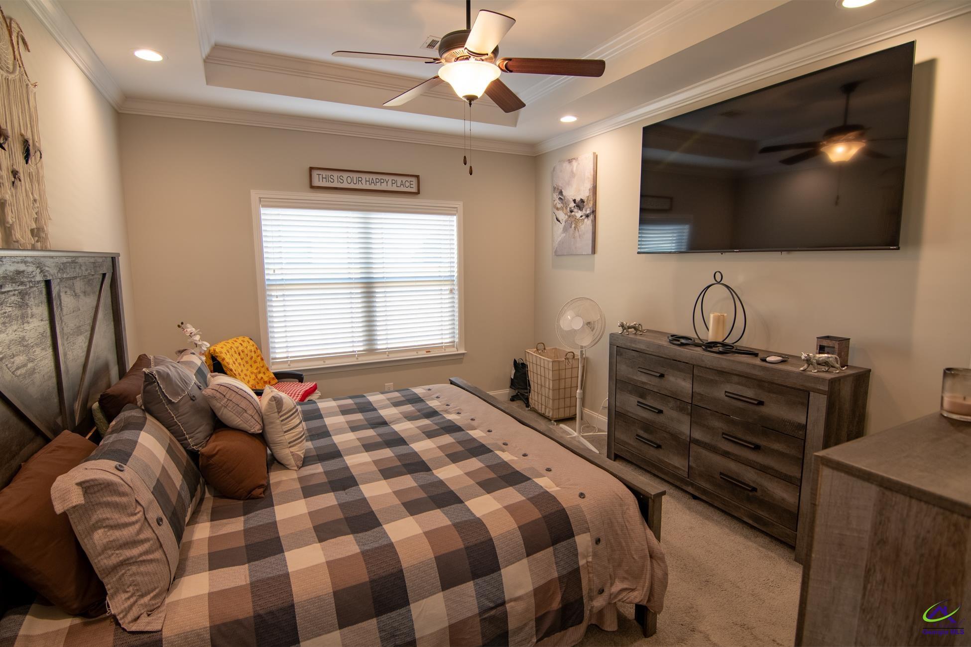 123 Logan's Mill Trail Warner Robins, GA 31093 - Photo 11 of 23 a bedroom with a bed and a flat screen tv