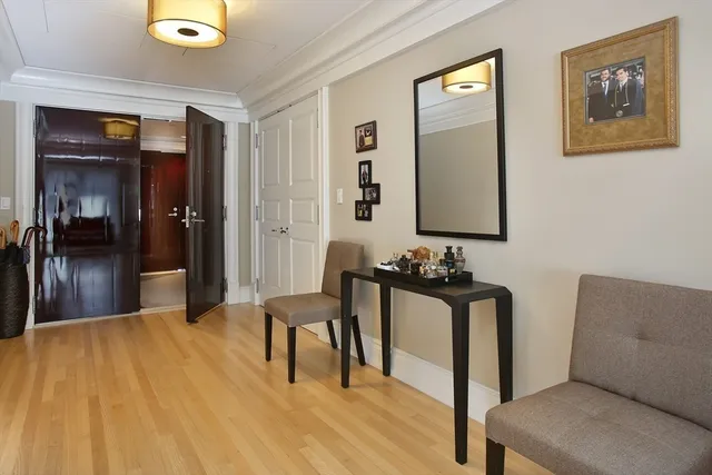 a view of a hallway with seating area